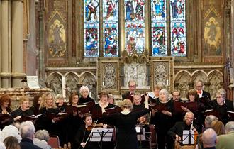 Choir performing to an audience in a church, music at Newport Minster, Isle of Wight, what's on, event