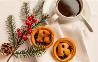 Mince pies, coffee and Christmas tree branch with red berries on a white cloth, Twixmas stay, hotel, Christmas event, what's on