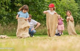 Children taking part in a sack race, Bembridge Windmill, National Trust, Isle of Wight, events, what's on - photo credit: David Kirkham