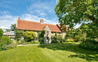 Outside view of Shalfleet Manor from garden, self-catering, Isle of Wight