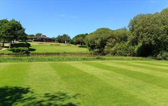 Course and clubhouse at Sandown & Shanklin Golf Club, Isle of Wight, activity