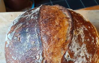 Sourdough bread on a wooden board, The Garlic Farm, Isle of Wight, what's on, event, workshop, food