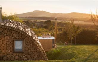 Outside view of Modulog with hot tub at Tapnell Farm, Isle of Wight, glamping, self catering - image credit: Skarsgard
