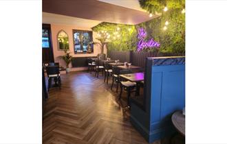 Isle of Wight, Eating Out, The Garden, Cowes, Inside seating with neon sign