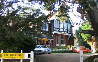 Front view of The Hermitage B&B and the driveway in front of B&B, bed and breakfast, Isle of Wight.
