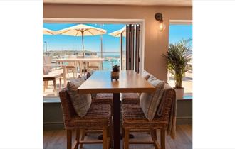 View of Yarmouth Harbour from inside and outside seating areas, The Terrace Yarmouth, restaurant