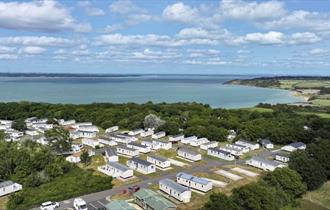 Aerial view of Thorness Bay Holiday Park, caravans, lodges, chalets, camping, touring pitches, glamping, outskirts of Cowes, Isle of Wight