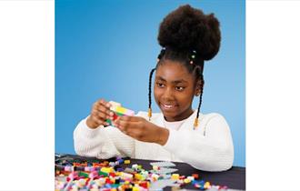 Girl building with bricks, Big Brick Build event at Osborne House on the Isle of Wight, children's event, family, what's on