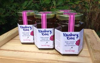 Pots of honey produced by Bunbury Bees placed on a tray outside, local producers, Isle of Wight, local produce, let's buy local