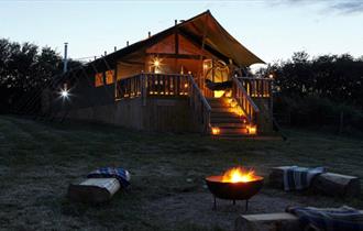 Outside view of safari tent at night, Glamping the Wight Way, self catering, Isle of Wight