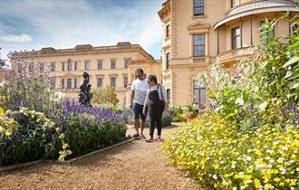 Couple walking around the garden outside Osborne House, garden tour, event, what's on, Isle of Wight