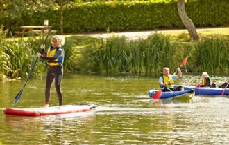 Family paddleboarding and kayaking at The Lakes Rookley, Isle of Wight, Things to do, watersports