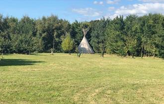 Outside view of a tipi, Isle of Wight Tipi Holidays, glamping, luxury, camping