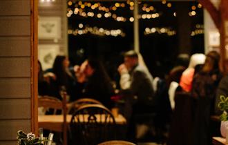 People eating inside The Garlic Restaurant, Isle of Wight, what's on, event, live music, food