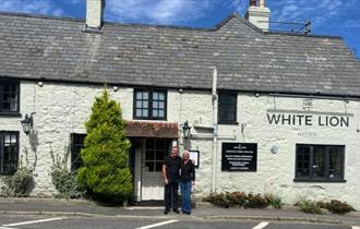 Managers of White Niton pub standing outside, Niton, Isle of Wight, eat & drink