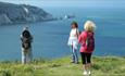 Group standing on cliff with The Needles in the background, Isle of Wight Guided Tours, Things to Do