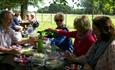 Group having a picnic within the grounds at Osborne, Isle of Wight Guided Tours, Things to Do