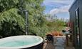 Hot tub outside of waterside lodge at Four Lakes Retreat, self catering, lakeside retreat, Isle of Wight