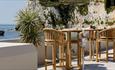 Tables and chairs on terrace with sea views at The Albion Hotel, Freshwater, boutique hotel, luxury, Isle of Wight