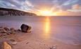 View of sunset over the Needles from Alum Bay beach, Isle of Wight, Things to Do