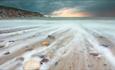 Wash of sea over pebbles on Alum Bay beach, Isle of Wight, Things to Do