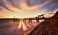 Sunset shining on the sea at Alum Bay beach, Isle of Wight, Things to Do