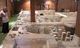 Lady viewing Roman bath at Newport Roman Villa, Isle of Wight, Things to Do