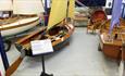 Collection of boats at The Boat Shed, Cowes, Isle of Wight, Maritime Museum