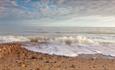 Waves crashing in over pebbles at Brook Beach, Isle of Wight, Things to Do