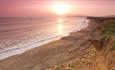 View of sunset over Brook Beach from cliff, Isle of Wight, Things to Do