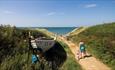 Family walking to Brook Beach, Isle of Wight, Things to Do