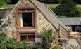 Isle of Wight, Accommodation, Brummell Barn, Image showing stone facade of barn.
