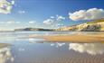 Clouds reflecting on sea at Compton Beach, Isle of Wight, Things to Do