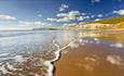 Sunny day with few clouds in the sky over Compton Beach, Isle of Wight, Things to Do