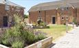 Outside view of the courtyard gardens within the cottages at Island Riding Centre, self catering, Newport, Isle of Wight