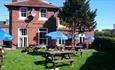 Garden with outdoor seating at The Waverley Inn, Carisbrooke, B&B