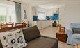 View of kitchen from open plan living area at Dairyman's Cottage, Tapnell Farm, Self-catering, West Wight, Isle of Wight