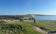Group of walkers on Tennyson Down looking towards Freshwater Bay on the Isle of Wight, Discover Wight, guided walks and tours, bespoke tours, walking