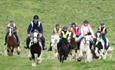 Group of people riding horses in the countryside, Fairfields Farm Riding School, Ryde, Isle of Wight, children's activities, family fun, adventure rid