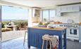 Kitchen at Flackstead with doors leading out to the patio with sea views, Wight Locations property, Isle of Wight, self catering, cottages and houses,