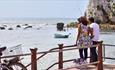 Couple fishing at Freshwater Bay Beach, Isle of Wight, Things to Do