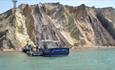 Boat at the pier at Alum Bay beach, Needles Pleasure Cruises, Isle of Wight, Things to do