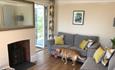 Isle of Wight, Accommodation, Self catering, Hill Croft, Niton Undercliff, Living Room with Tan Labrador Dog holding a pink ball.