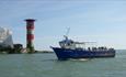 Group of people on boat sailing around the Needles, Needles Pleasure Cruises, Isle of Wight, Things to do