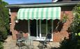 View of patio with two dining chairs and table at Studio Annexe, Self-catering, Isle of Wight