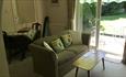 Lounge and dining area with doors that open onto the garden at Sudio Annexe, Self-catering, Isle of Wight