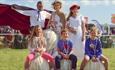 Adults and children with bouncing garlic bulbs at the Isle of Wight Garlic Festival, what's on, event