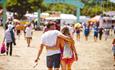 Couple cuddling and walking around the Isle of Wight Festival, music, events, what's on