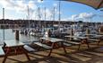 Outside seating on decking overlooking the marina at The Lifeboat, East Cowes, local produce, let's buy local