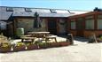 Outside view of Lavender Cottage with outdoor picnic table, Atherfield Green Farm Holiday Cottages, Chale, Self Catering